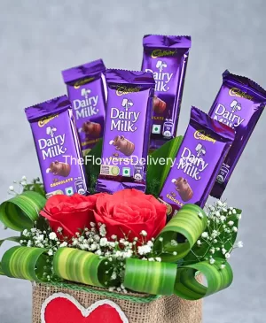 Cocoa Kisses of Love-Flowers and chocolates delivery Perfect gift combo: flowers and chocolates-Send flowers and chocolates-Sweet blooms and chocolates-Flower and chocolate arrangements- Delightful flowers with chocolates- Express love with flowers and chocolates-Ultimate flowers and chocolates pairing- Stunning bouquet and chocolates-TFD Pakistan-theflowerdelivery.com