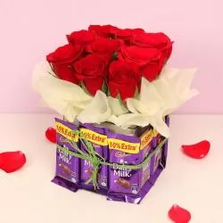 Chocolate Vase With Beautiful Red Roses-Flowers and chocolates delivery- Perfect gift combo: flowers and chocolates-Send flowers and chocolates-Sweet blooms and chocolates-Flower and chocolate arrangements-Delightful flowers with chocolates- Express love with flowers and chocolates-Ultimate flowers and chocolates pairing- Stunning bouquet and chocolates-TFD Pakistan-theflowerdelivery.com